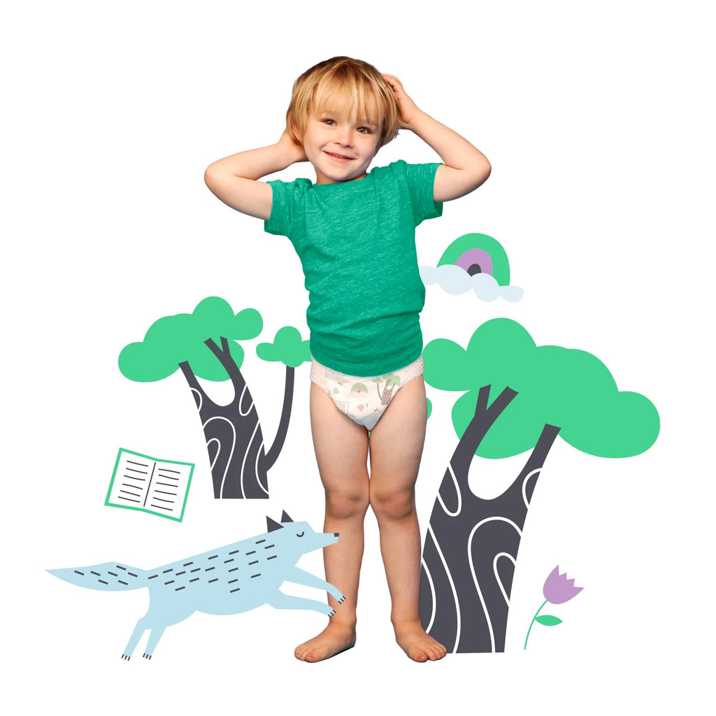 Child in green shirt with forest illustration.