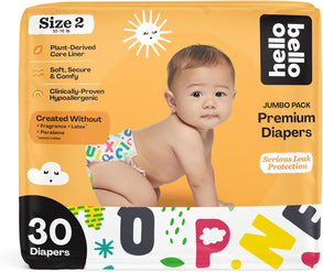 Baby in diaper packaging with product details.