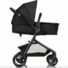 A black stroller with a white frame and wheels.