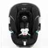 A black car seat with the front facing child.