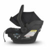 A black infant car seat with the back of it.