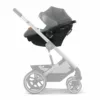 A baby stroller with the seat folded up.