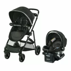 A black stroller and car seat set up to go.