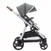 A stroller with wheels and two different colors of handles.