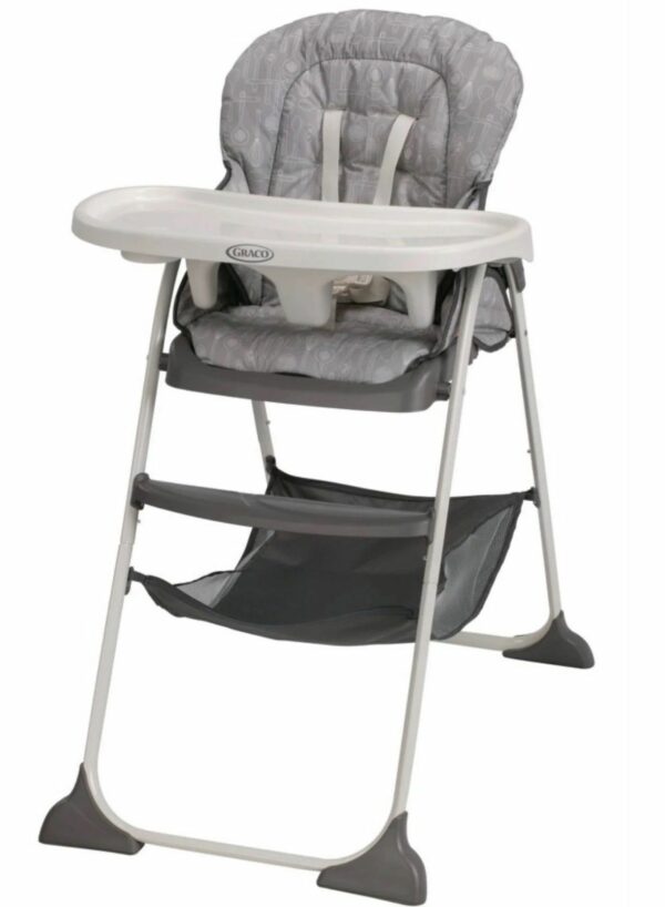 A baby high chair with a seat that is folded up.