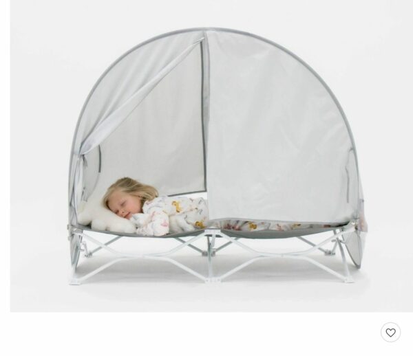 A child is sleeping in the tent bed.