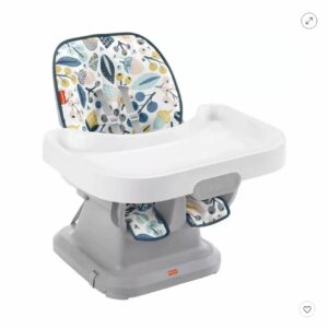 A baby high chair with a tray and seat.