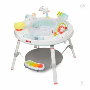 A baby 's activity center with a tray and table.