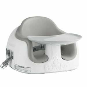 A gray and white booster seat with two straps.