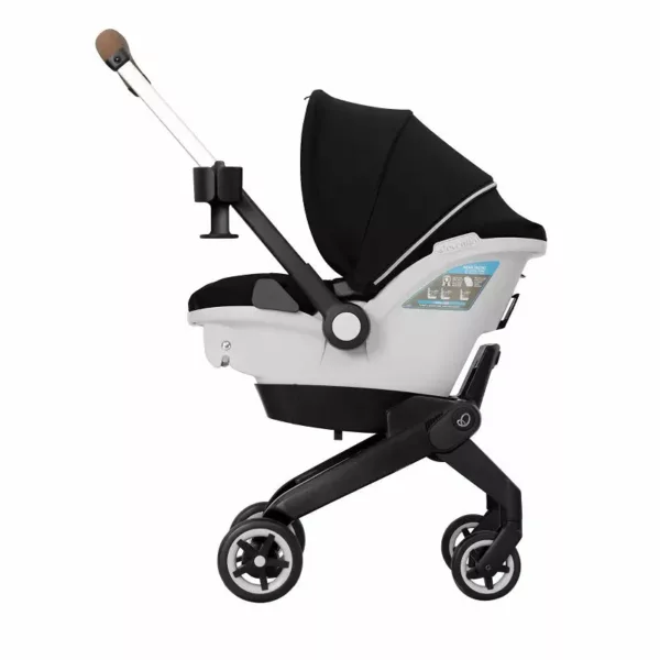 A stroller with the handle extended and a black seat.